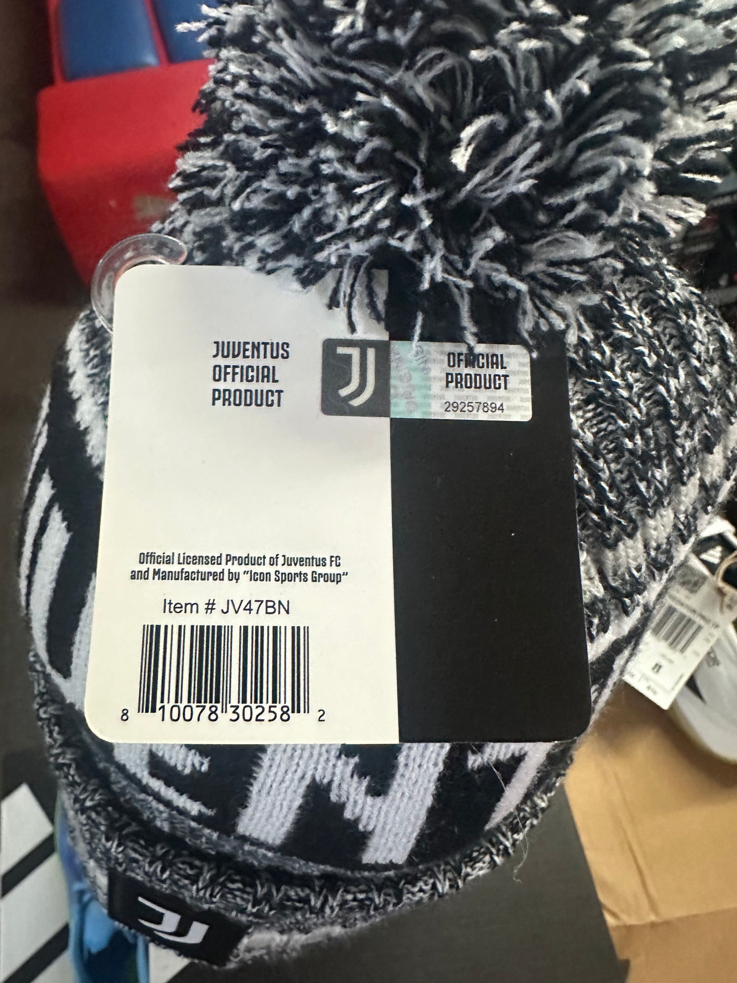Black and white patterned product with Juventus branded tag on a blurred background
