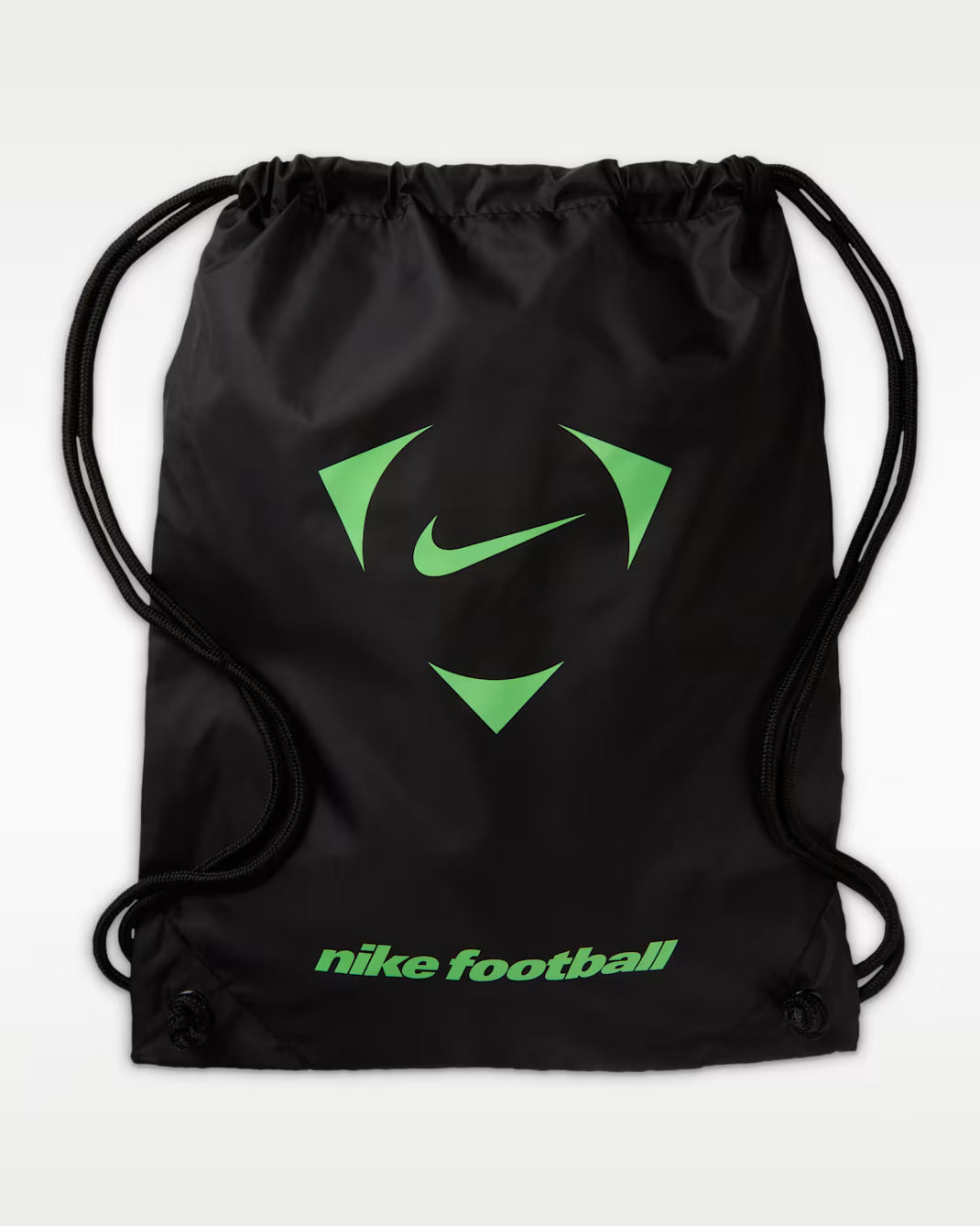 A black Nike drawstring bag with a green Nike logo and 'nike football' text printed on the front, set against a light gray background.