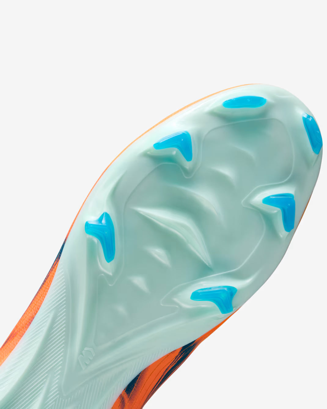 Close-up of a sports shoe sole with blue cleats on a white background