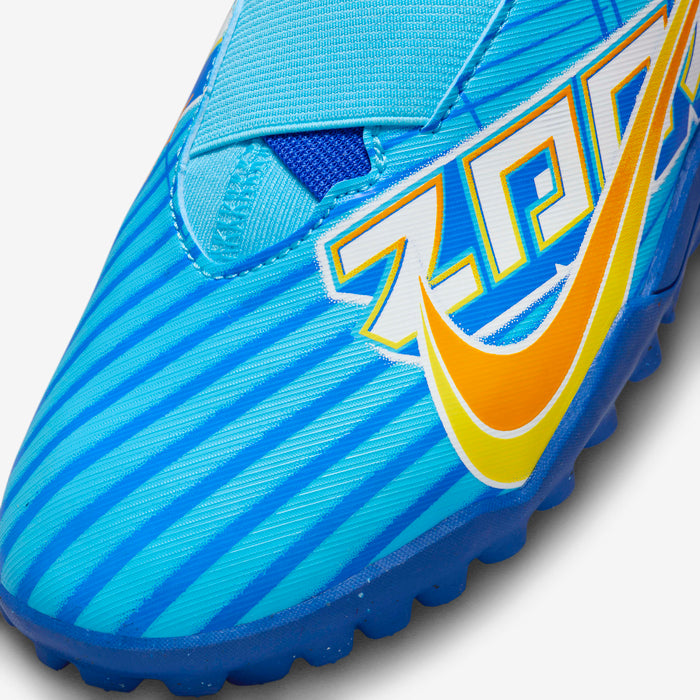 Blue soccer cleat with brand logo on a light gray background