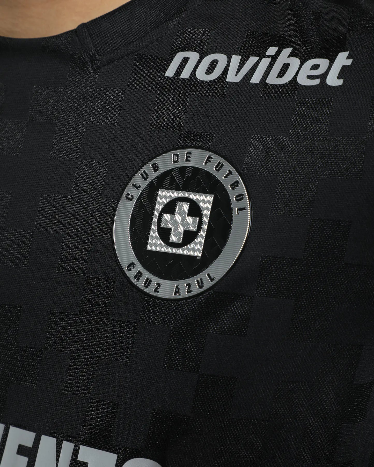 Black sports jersey with 'novibet' branding and a logo on a dark background