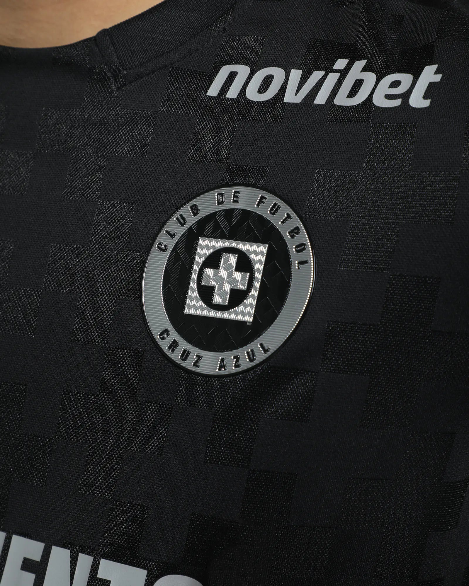 Black sports jersey with 'novibet' branding and a logo on a dark background