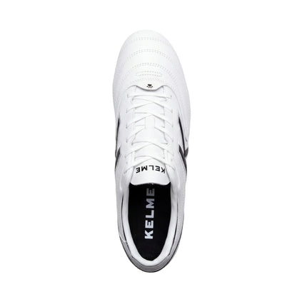 KELME SELECTA White sports shoe with black sole on a white background