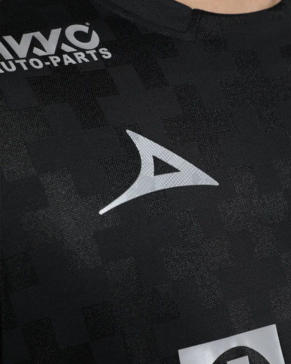 Black shirt with a logo and text on a dark background