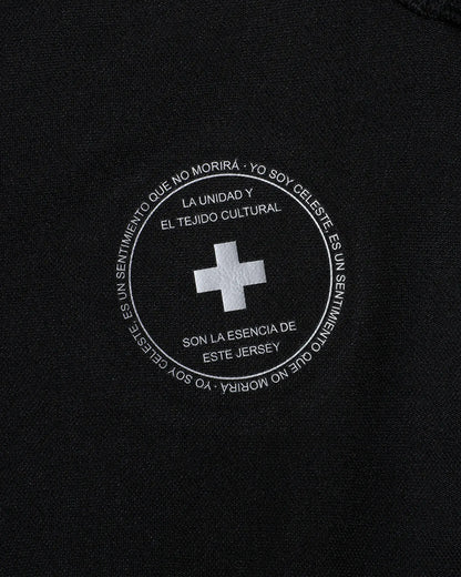 Black jersey with white text and cross emblem on a black background