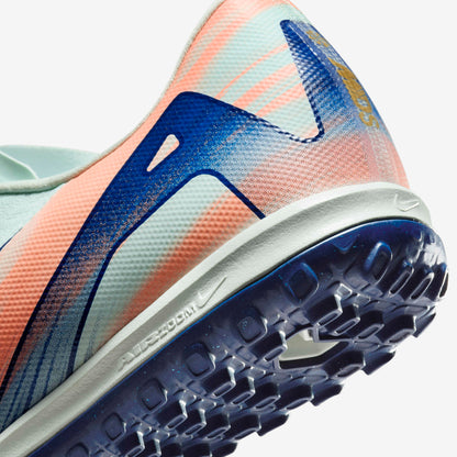 Close-up of Nike Phantom GX 2 Academy FG/MG grip texture and Honeycomb Green finish