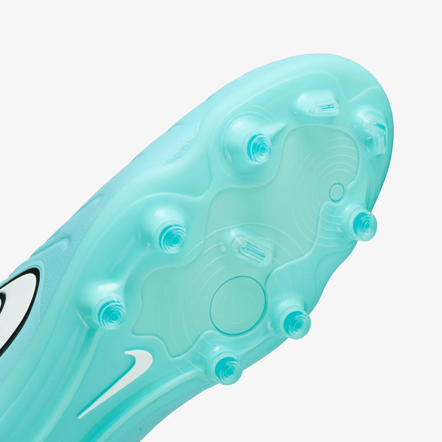 Close-up of a light blue soccer cleat sole with Nike logo on a white background