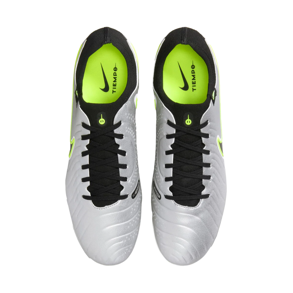 Pair of white soccer cleats with black and green accents on a white background