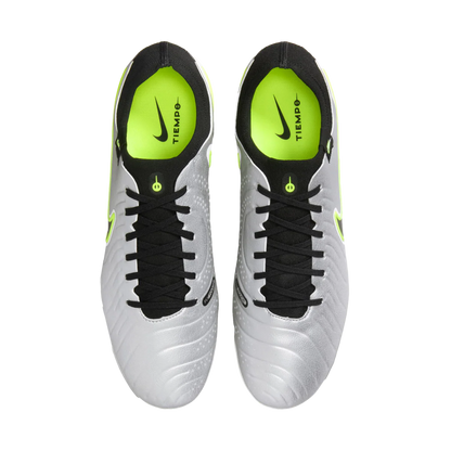 Pair of white soccer cleats with black and green accents on a white background