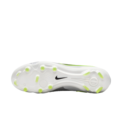 White athletic shoe with green accents on a white background