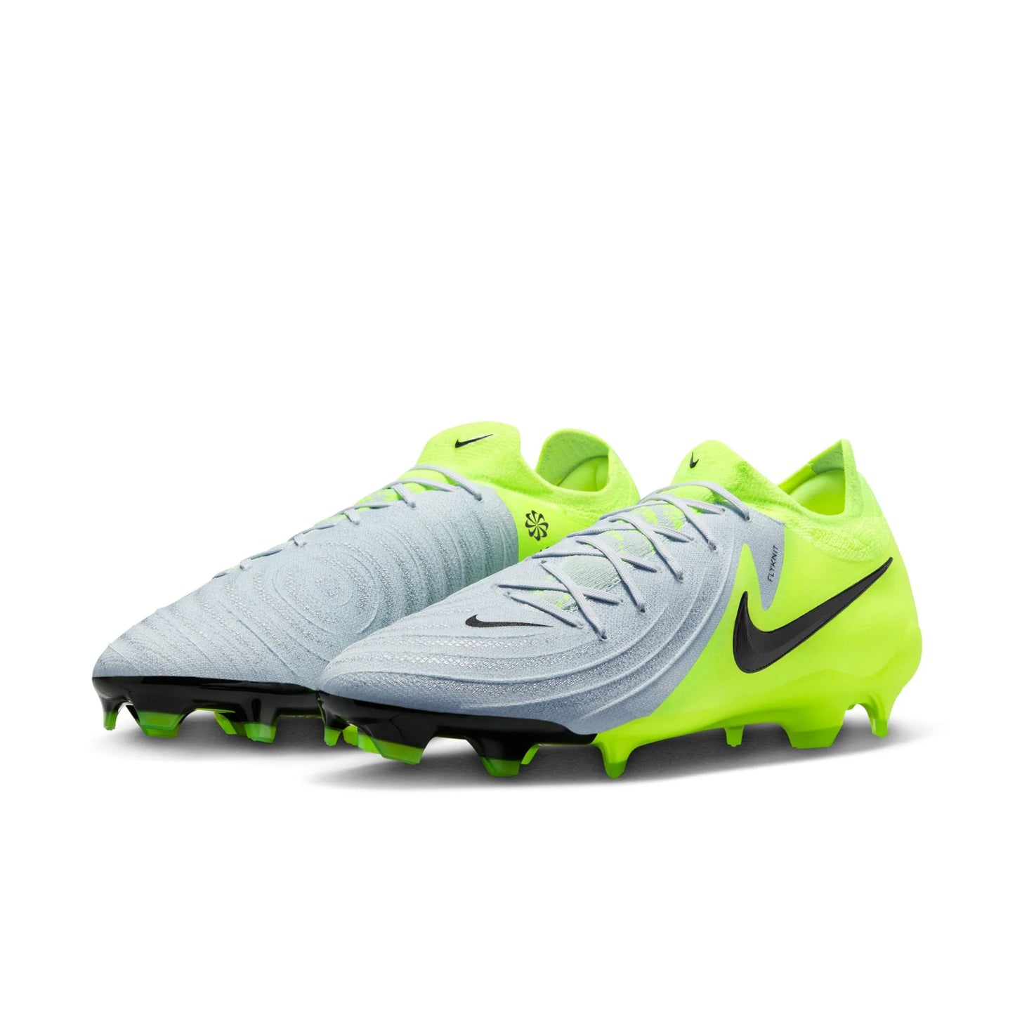 Pair of neon green and light gray soccer cleats on a white background