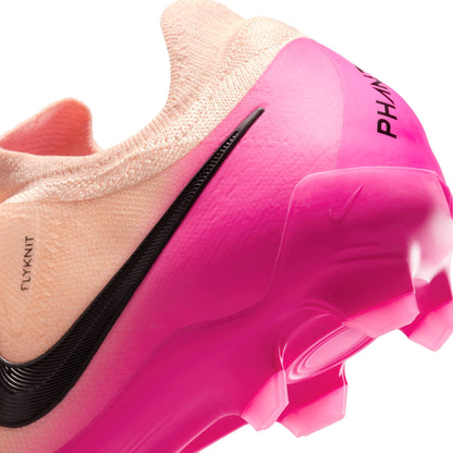 Close-up of a pink cleats with visible branding on a white background