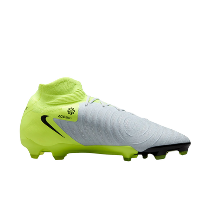 Football boot with green and gray design on a white background