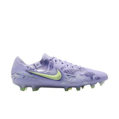 Purple soccer cleat with green accents on a white background