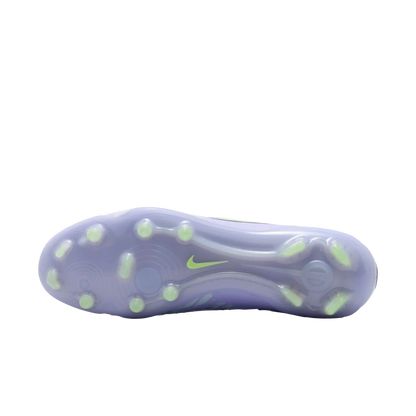 Purple athletic shoe sole with green accents on a white background