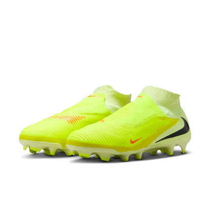 Pair of bright yellow soccer cleats with Nike logo on a white background