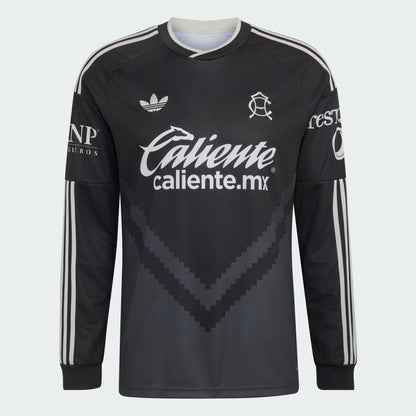 A black long-sleeve soccer jersey with white stripes on the sleeves, featuring the Adidas logo, Caliente.mx sponsor text, and Club America club crest on a light gray background.