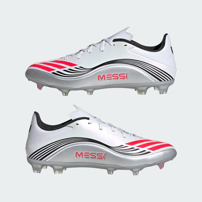 White soccer cleats with red and black accents and 'Messi' branding on a light gray background.