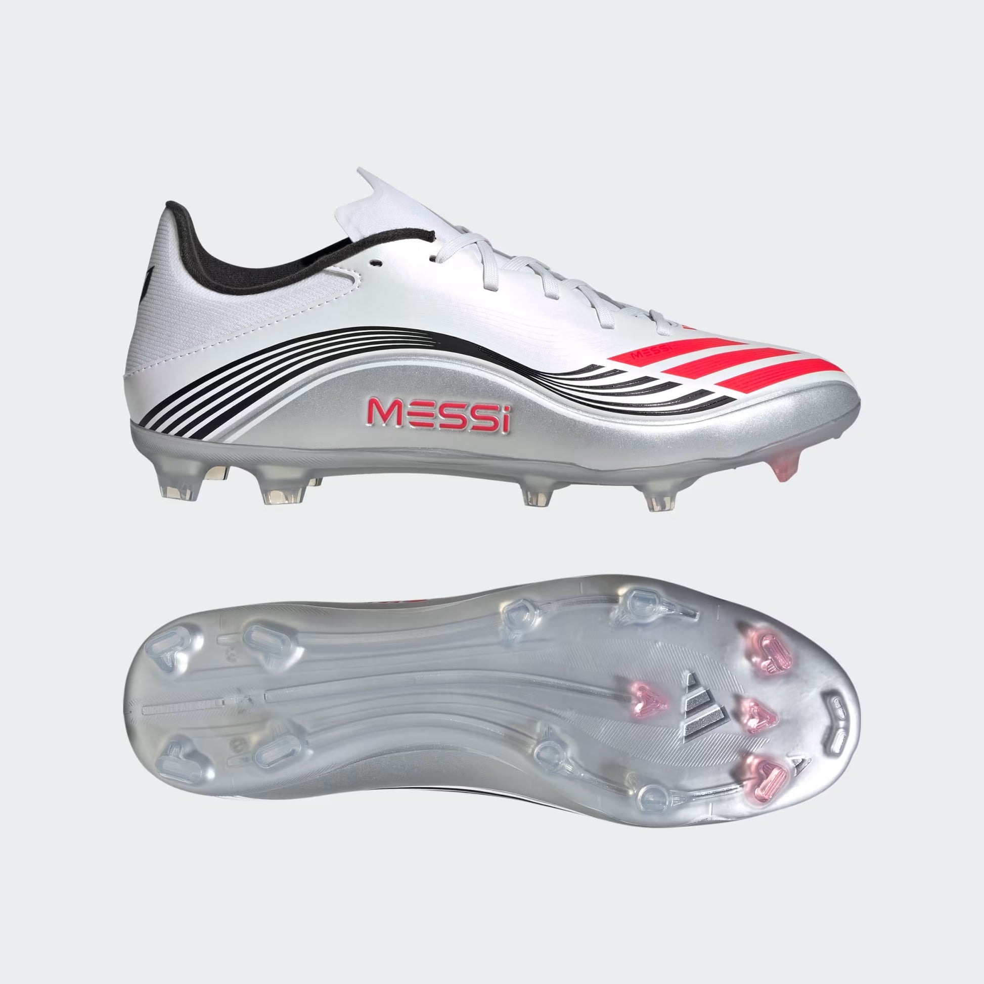 White soccer cleats with red and black accents on a light gray background, featuring the brand 'Messi'.