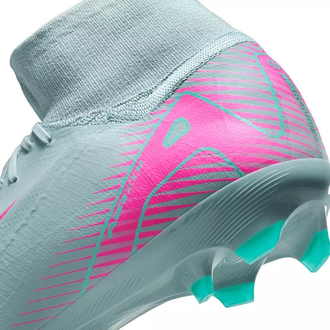 Close-up of a sports shoe with pink and teal design on a white background