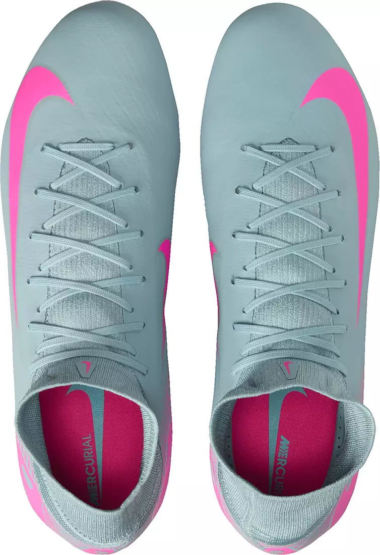 Gray soccer cleats with pink accents on a white background