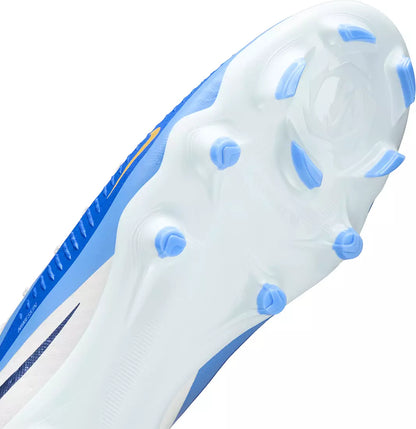 Close-up of a blue and white soccer cleat sole with tread pattern on a white background
