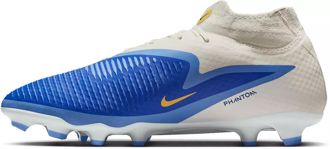 Beige and blue soccer cleat with Nike logo on a white background
