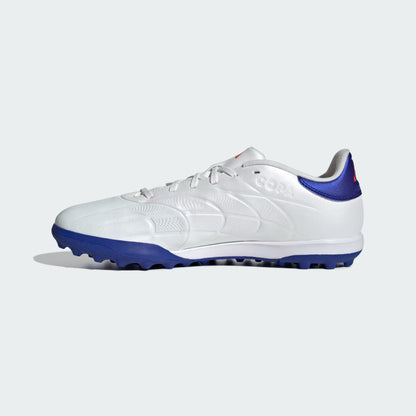 White and blue soccer cleat on a light gray background
