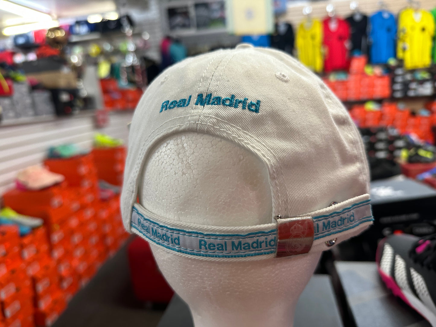 whitecap with 'Real Madrid' branding in a store setting