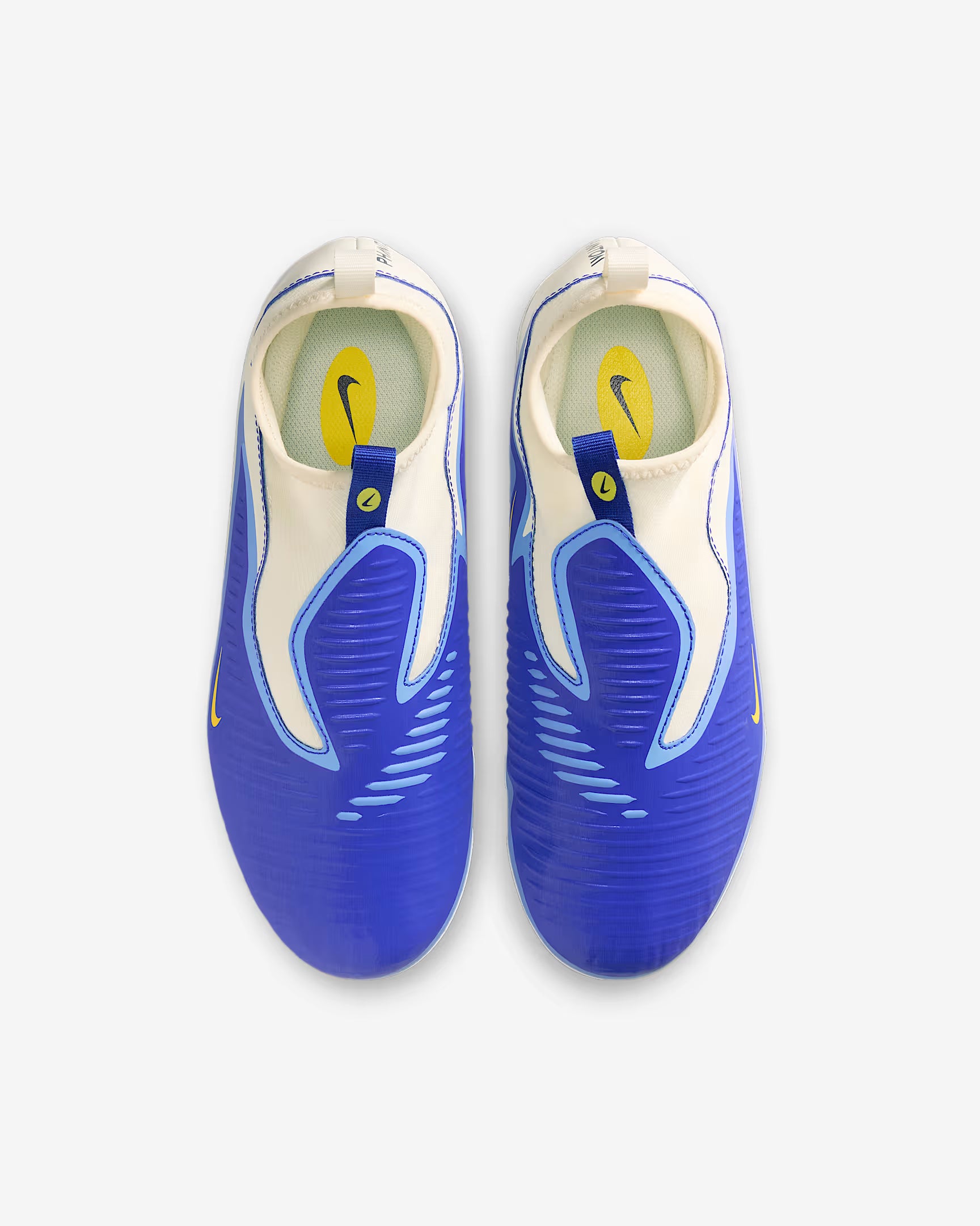 Pair of blue and white soccer cleats on a white background