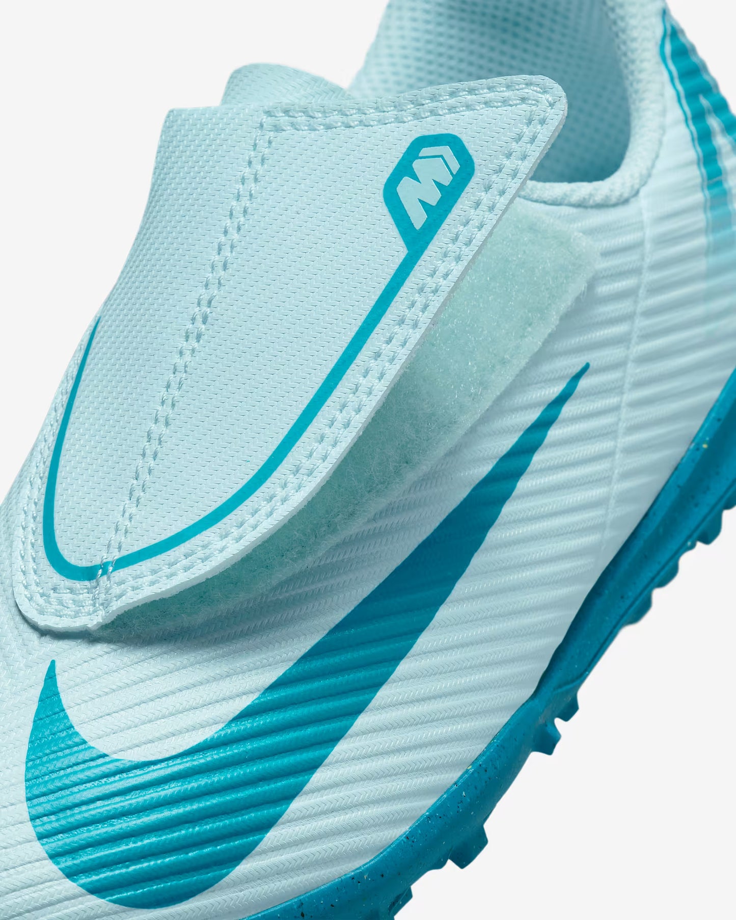 Light blue soccer cleat with a brand logo on a white background