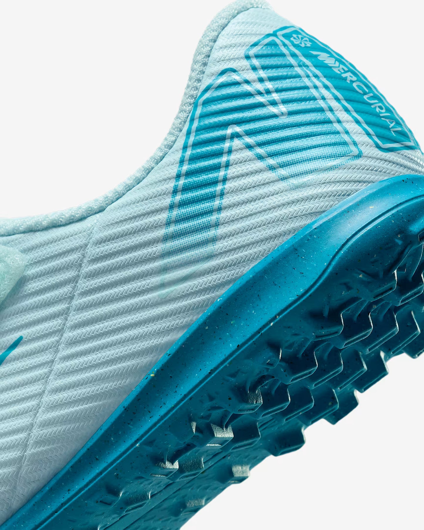 Close-up of a blue and white soccer cleat with 'Mercurial' branding.
