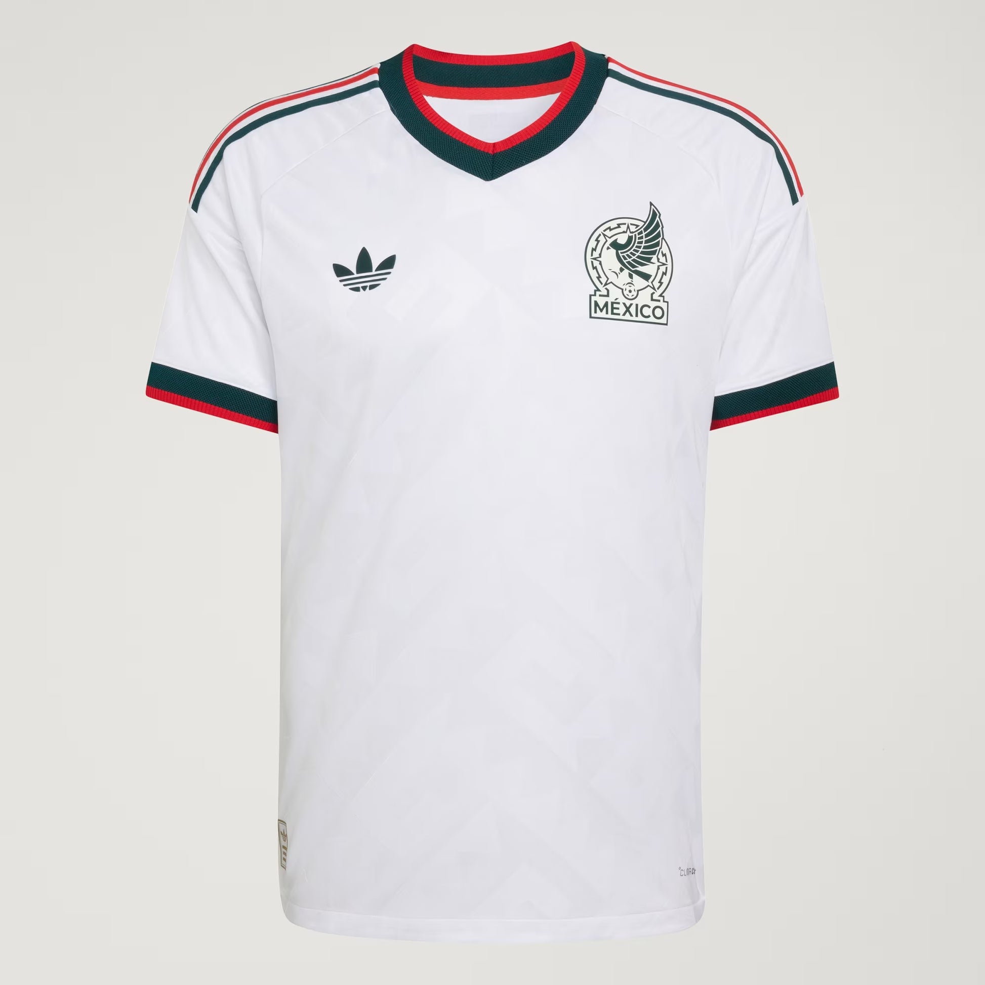 White sports jersey with Adidas logo and 'Mexico' emblem on a light gray background