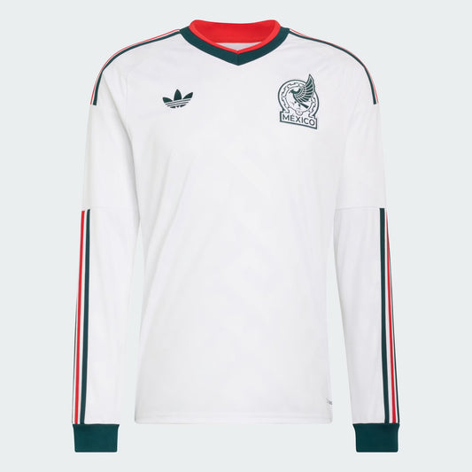 White long-sleeve shirt with red and green accents, featuring Adidas logo and Mexico emblem on a light gray background.