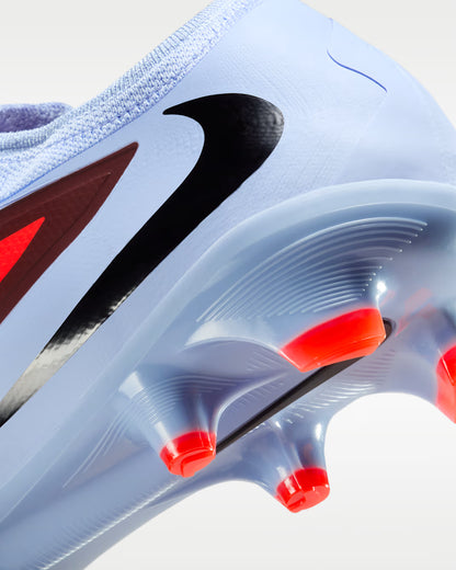 Close-up of a sneaker with a prominent Nike logo on a light background