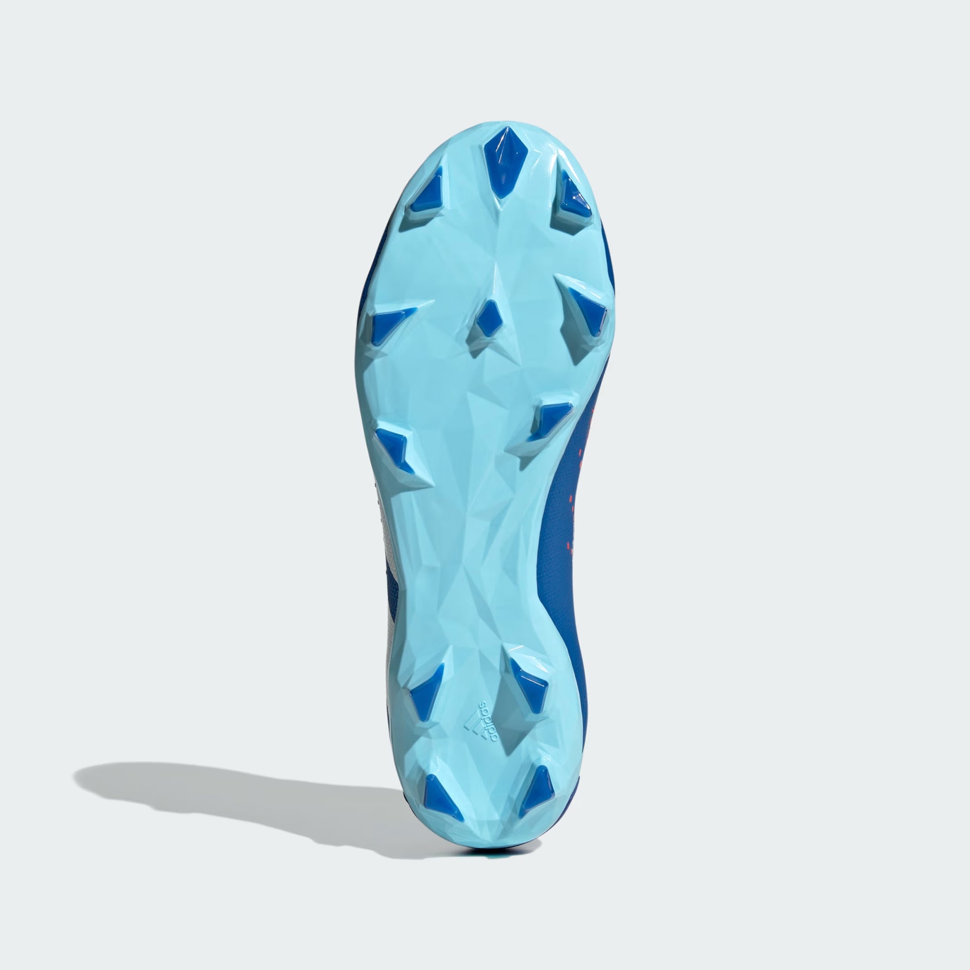 Blue athletic shoe sole on a light gray background