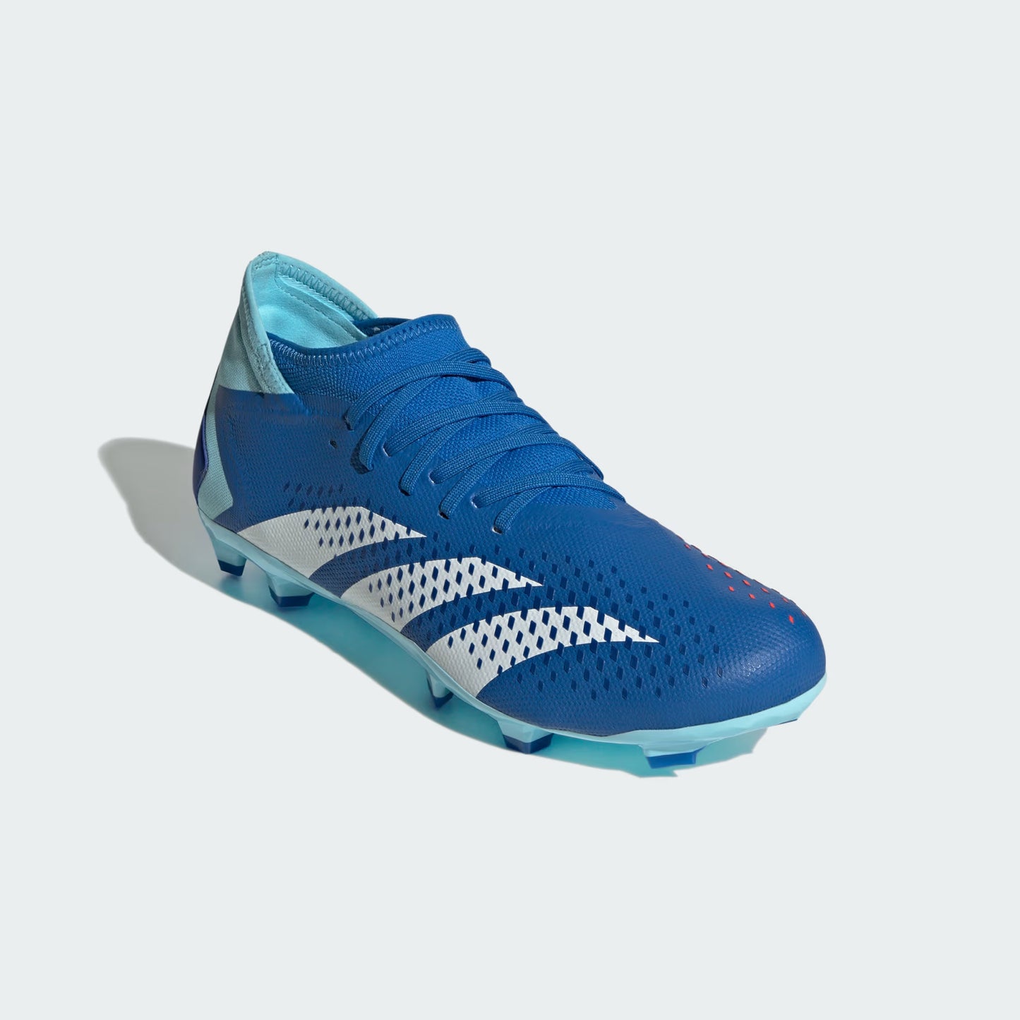Blue soccer cleat with white accents on a light gray background