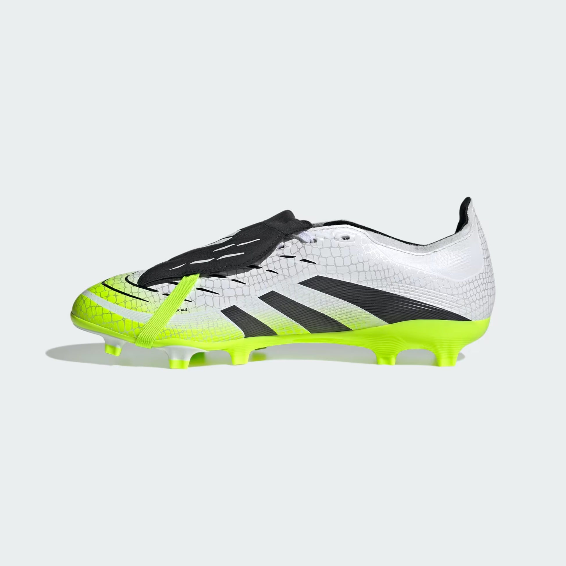 White and black soccer cleat with neon green accents on a light gray background