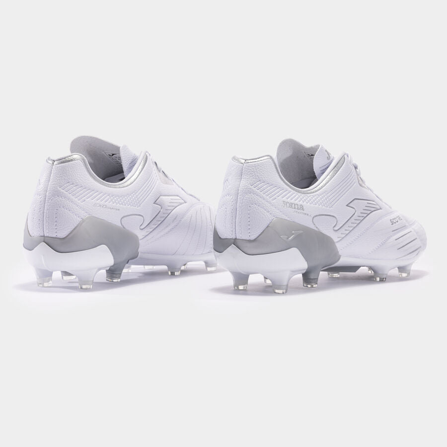 Pair of white soccer cleats on a light gray background