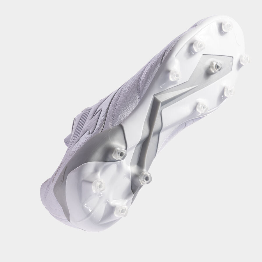 Close-up of a white athletic shoe with cleats on a light gray background