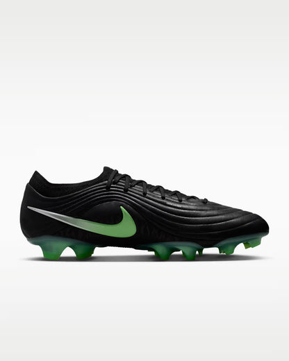 Black soccer cleat on a white background