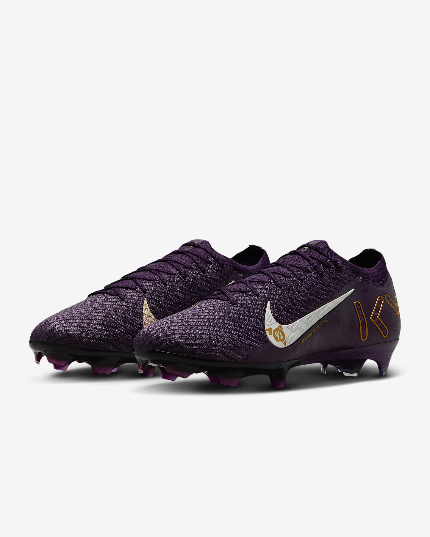Purple soccer cleats with a white Nike logo on a light gray background