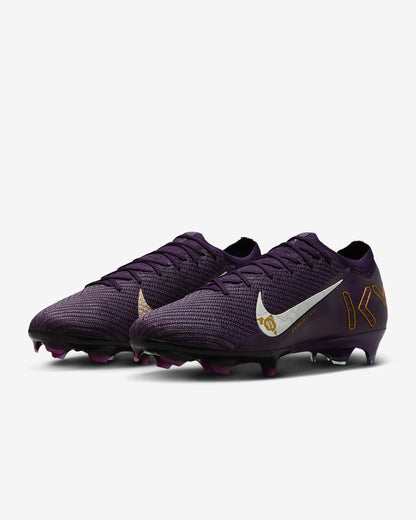 Purple soccer cleats with a white Nike logo on a light gray background
