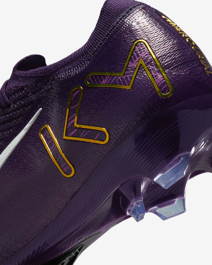 Purple sports shoe with gold and pink accents on a white background