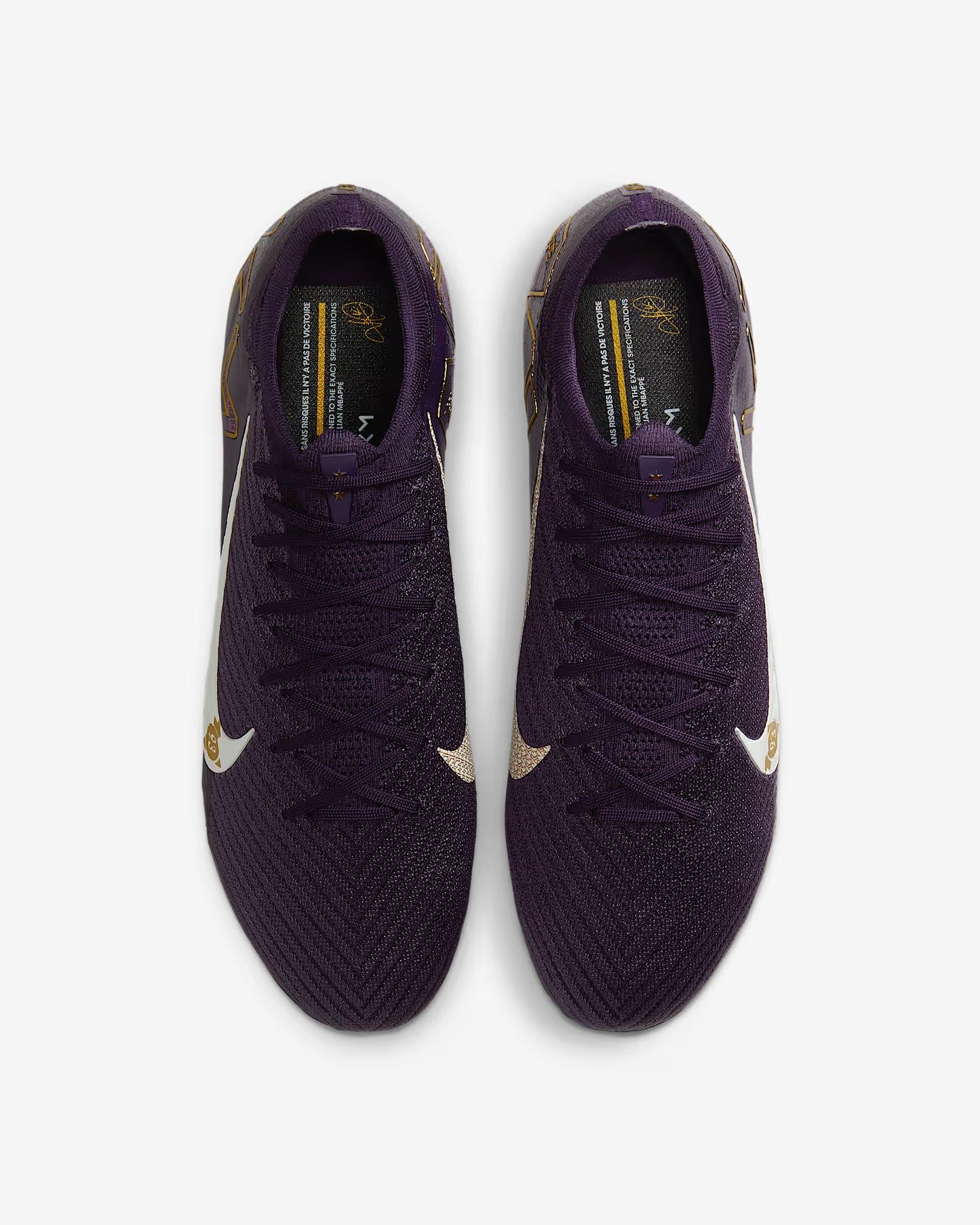 Purple soccer cleats with gold accents on a white background