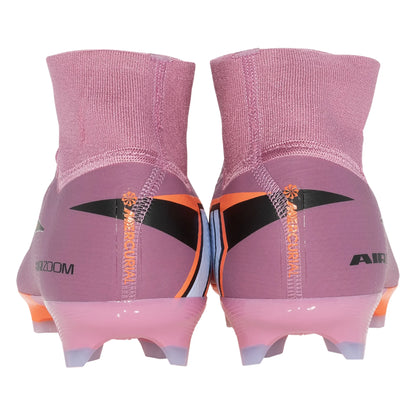Pink athletic shoes with black and orange accents on a white background