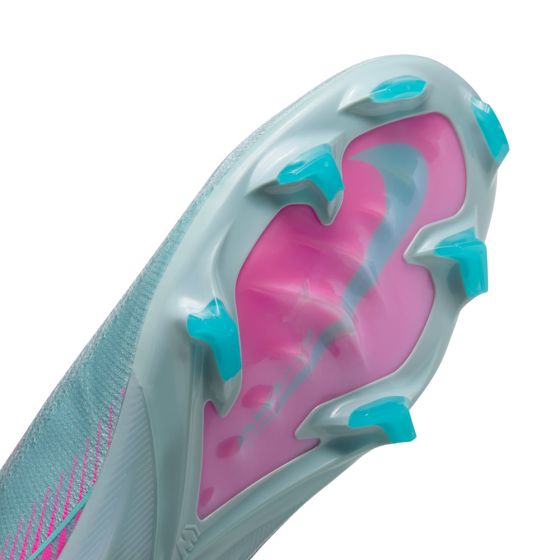 Close-up of a shoe sole with pink and blue design on a white background