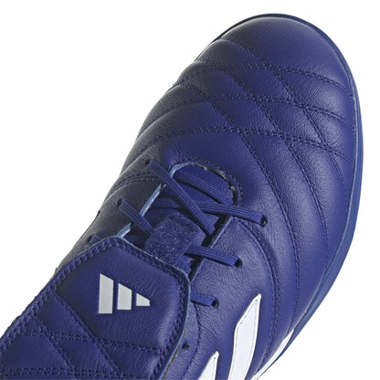 Blue Adidas soccer shoe on a white background