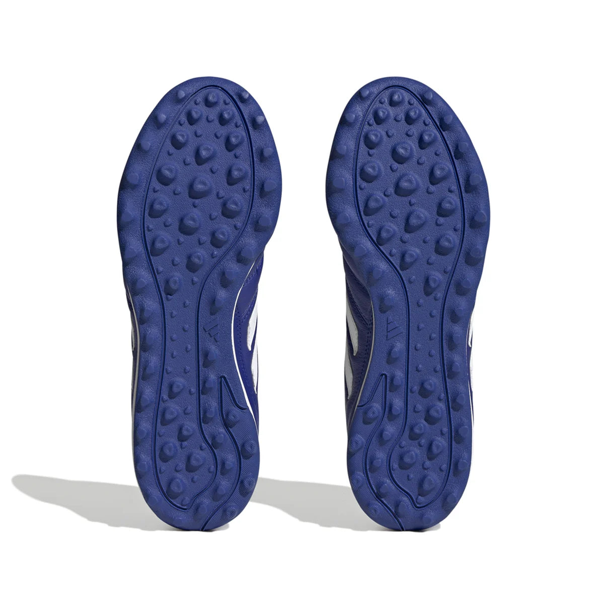 Blue shoe soles with textured pattern on a white background